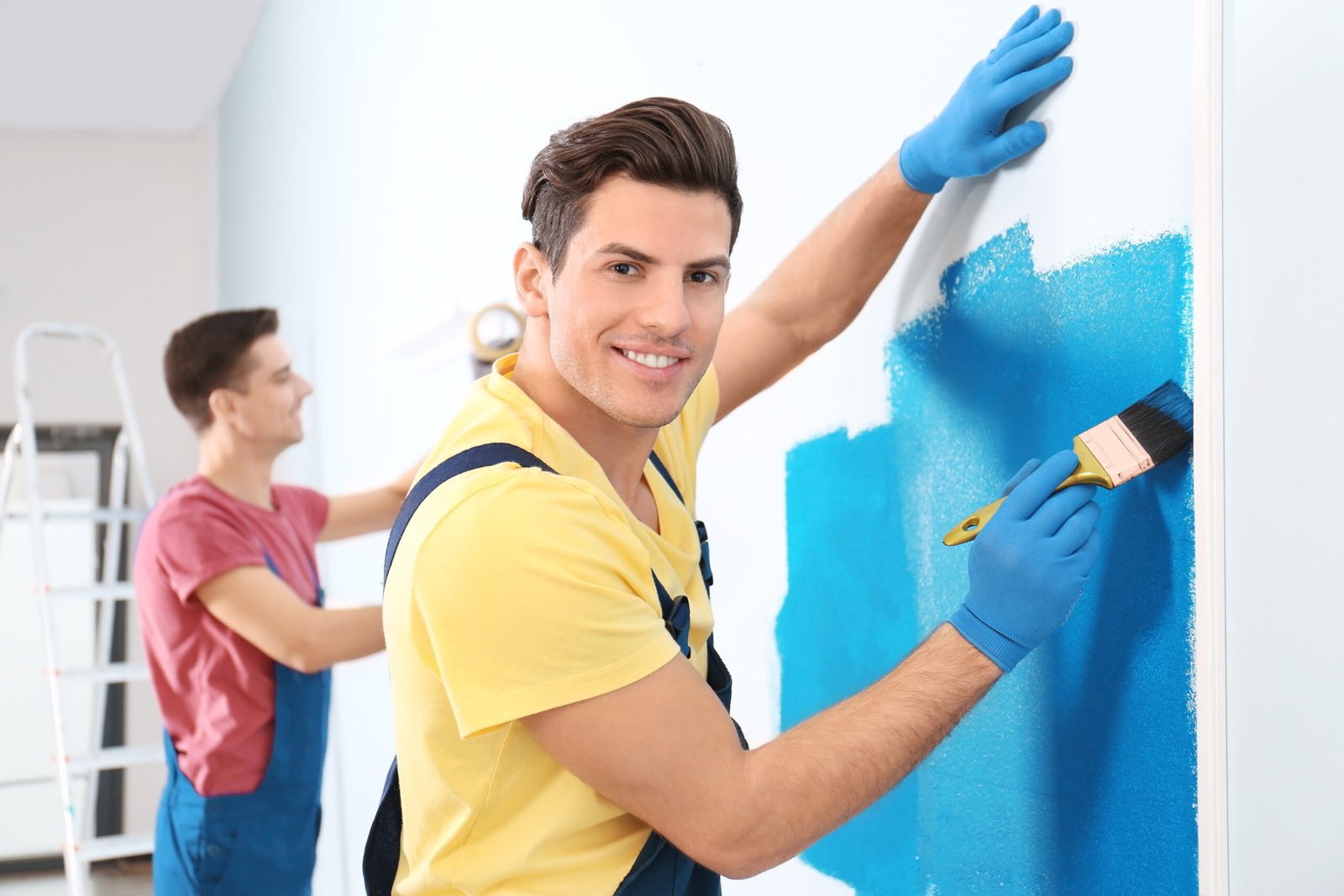 male decorator painting wall with brush indoors 2026 01 15 21 33 19 utc scaled