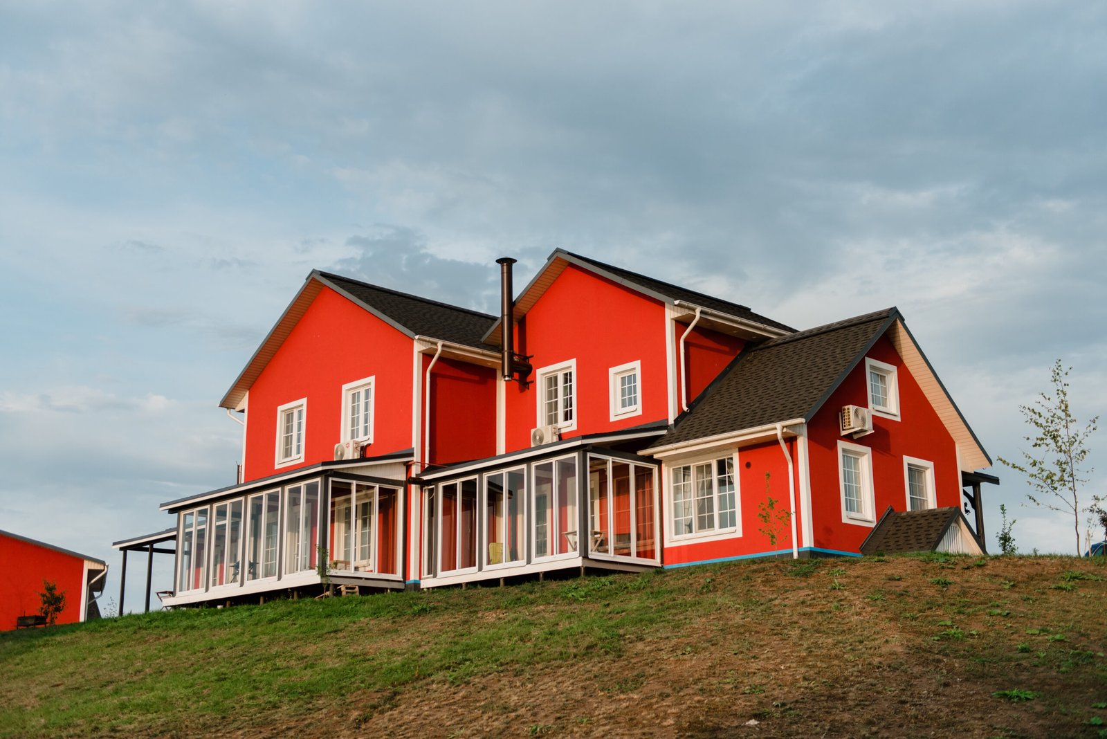 red scandinavian house at sunset 2026 01 09 12 05 48 utc scaled