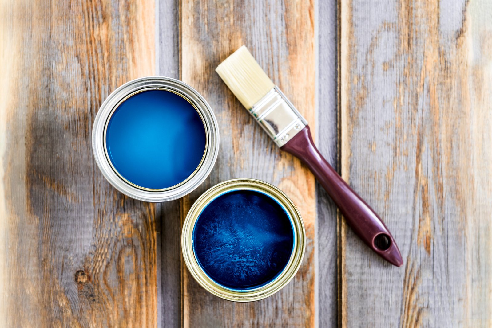 wooden box with brush and open cans of blue paint 2026 03 18 15 36 20 utc scaled